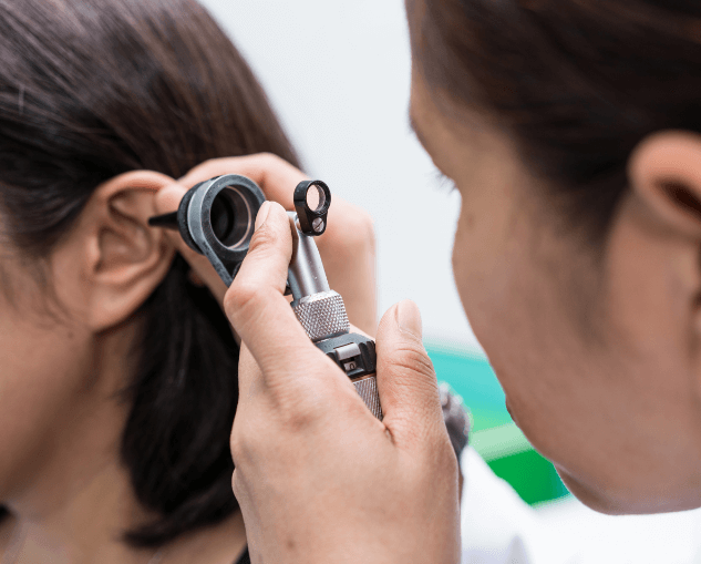 Female Patient Undergoing Hearing Assessment at Smiles From Ear to Hear